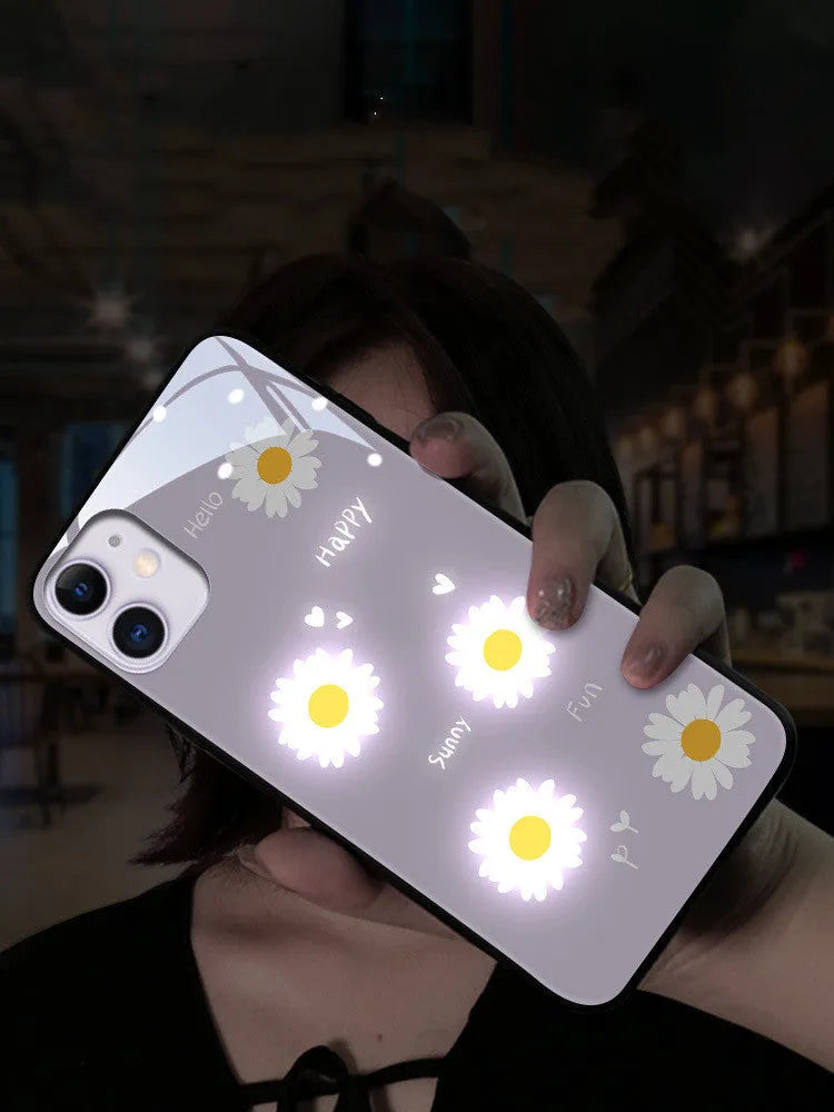 White TPU iPhone case with painted purple daisies and letters, showing voice-activated colour light feature.