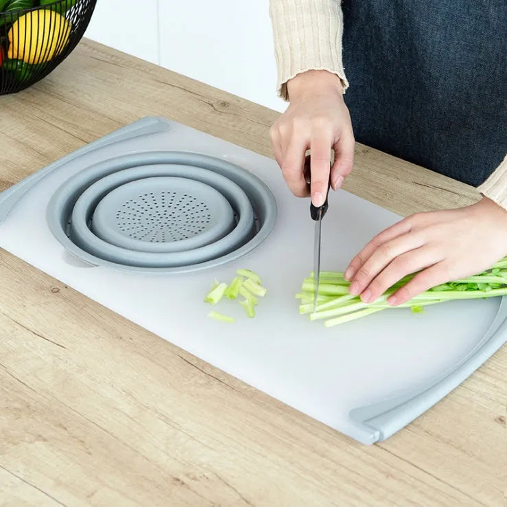Grey multi-functional chopping board with detachable drain basket showing 50cm cutting surface