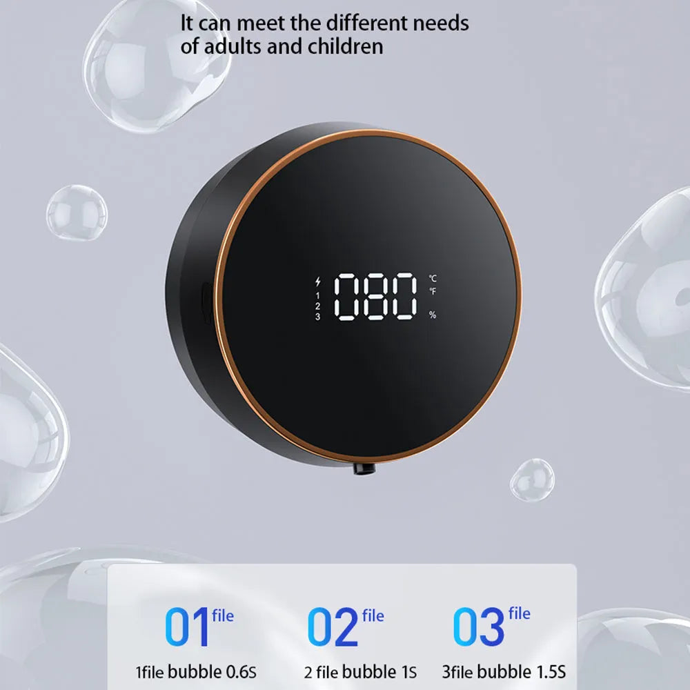 Black automatic sensor foam soap dispenser with USB port mounted on a white bathroom wall.
