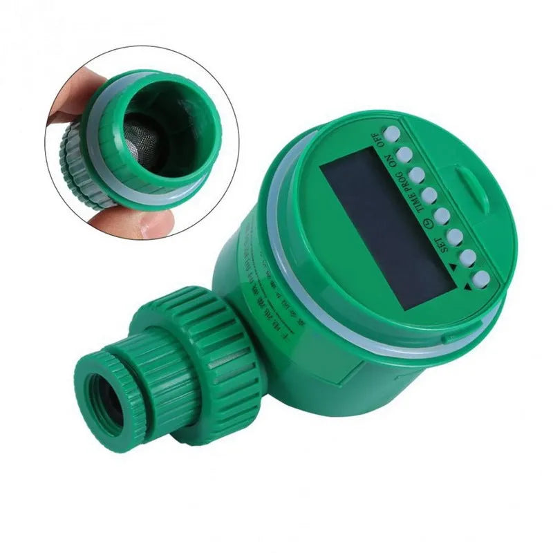 Green plastic automatic watering timer with digital display for garden hose connection.