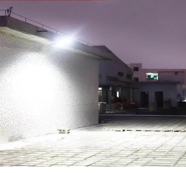 Black solar-powered outdoor motion sensor light with IP65 waterproof rating for garden and driveway security.