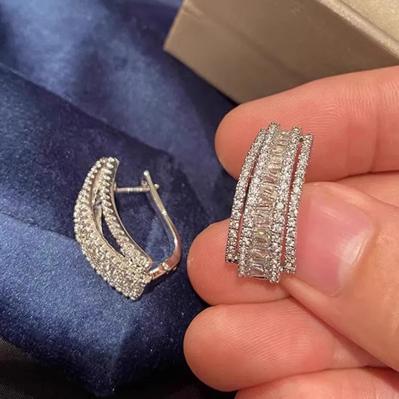 Women's geometry-shaped stud earrings with zircon detailing in white gold colour