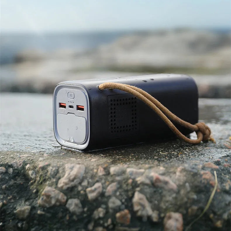 Black emergency power bank with 200W output, solar panel charging capability, and dimensions of 70x70x162mm