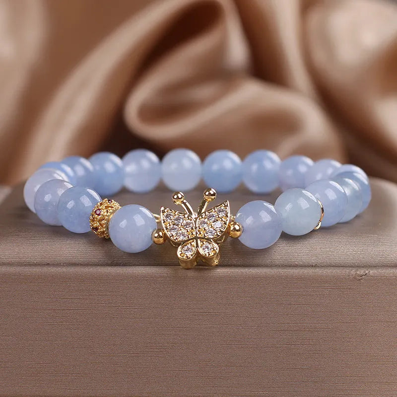 Sky blue butterfly crystal bracelet for women with pearls, rhinestones, and sequins on a 17cm chain.