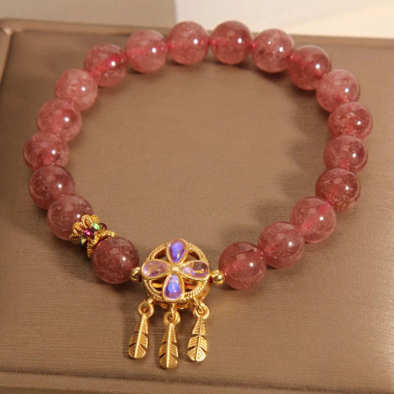 Women's strawberry quartz bracelet with dream catcher pendant and four-leaf clover charm in natural pink crystal