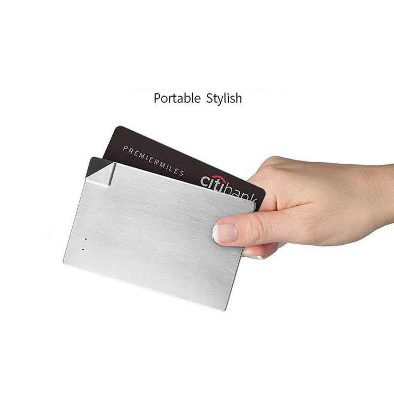 Sliver-coloured graphene battery power bank, 4000mAh capacity, shown next to a mobile phone.