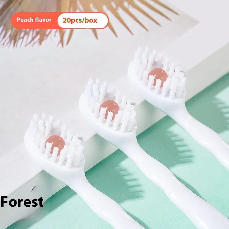 Box of 20 disposable beaded travel toothbrushes in individual wrappers.