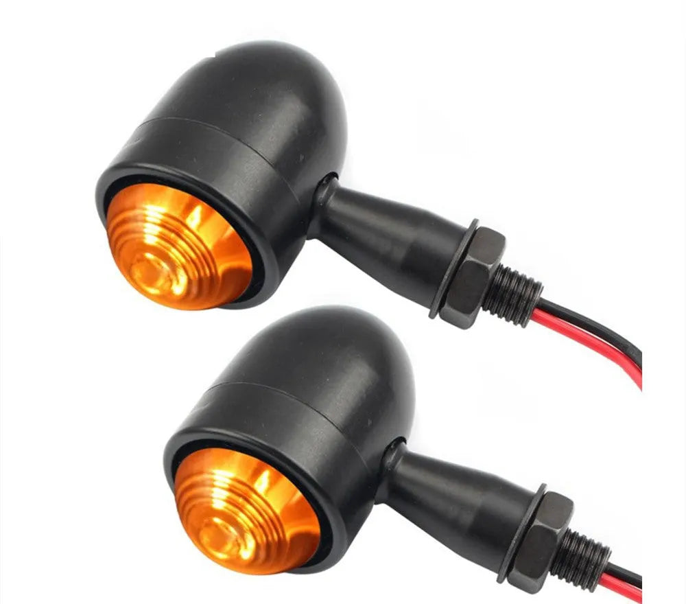 Motorcycle turn signal with metal back shell, plastic lens, 12V 2-wire connection, and 10mm mounting bolt thread