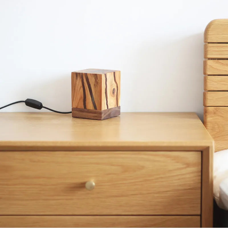 Creative crack night lamp in wood and PMMA with USB cable on bedside table