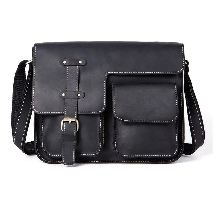 Brown full-grain leather vintage messenger bag with brass hardware, showing front flap and adjustable crossbody strap.