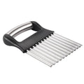 Stainless steel potato wave knife for making crinkle-cut chips on a kitchen worktop.