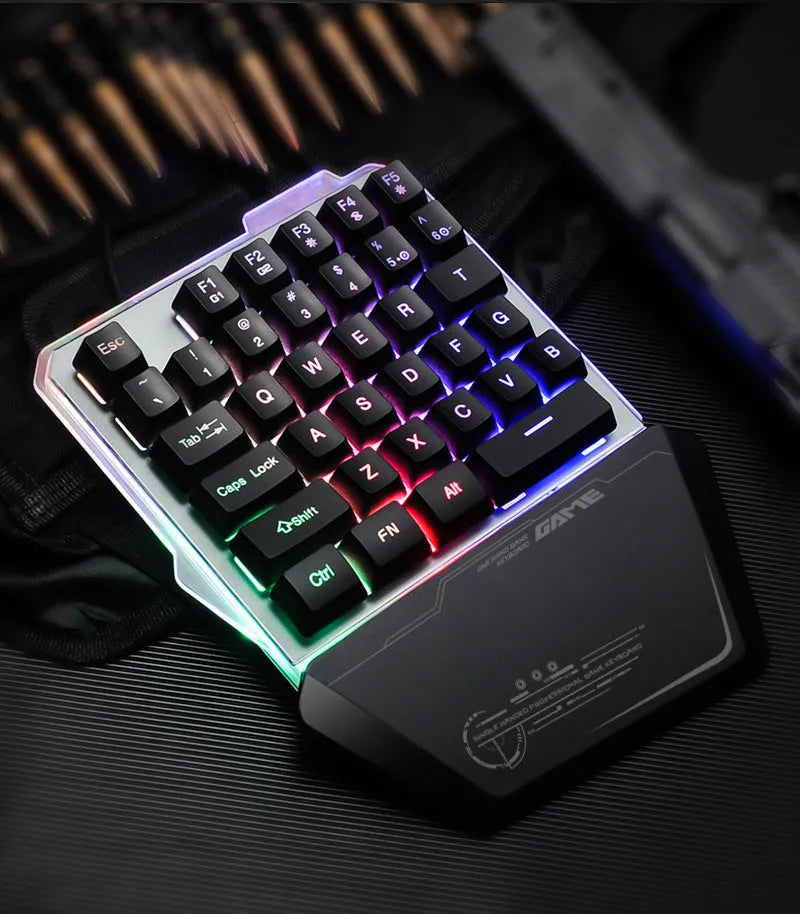 Black G40 Flow one-handed robotic gaming keyboard with RGB backlit keys on a desk.