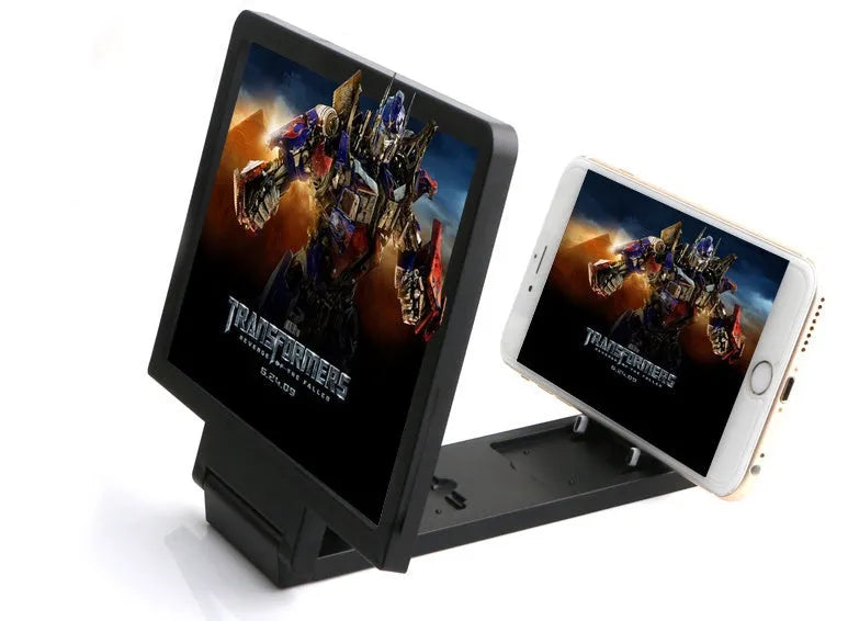 Black or white portable screen amplifier magnifier for mobile phones and laptops on a table.