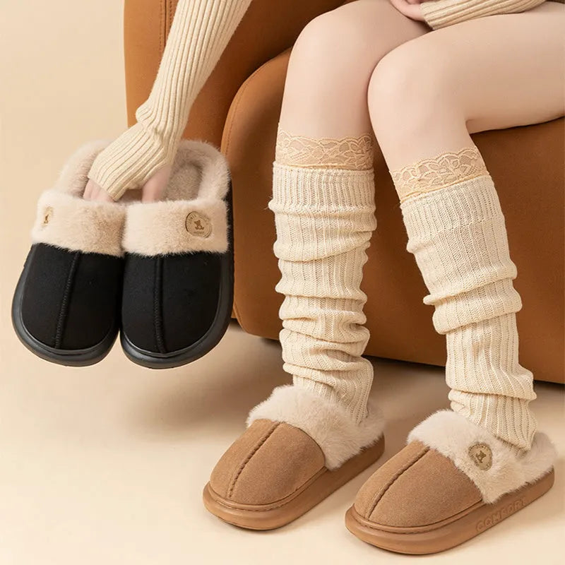 Plush fleece winter slipper with thick PVC sole, shown in khaki colour with car stitching detail.