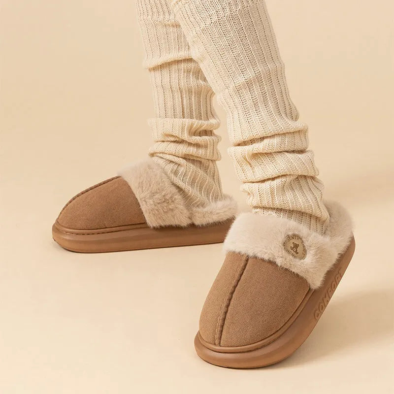 Plush fleece winter slipper with thick PVC sole, shown in khaki colour with car stitching detail.