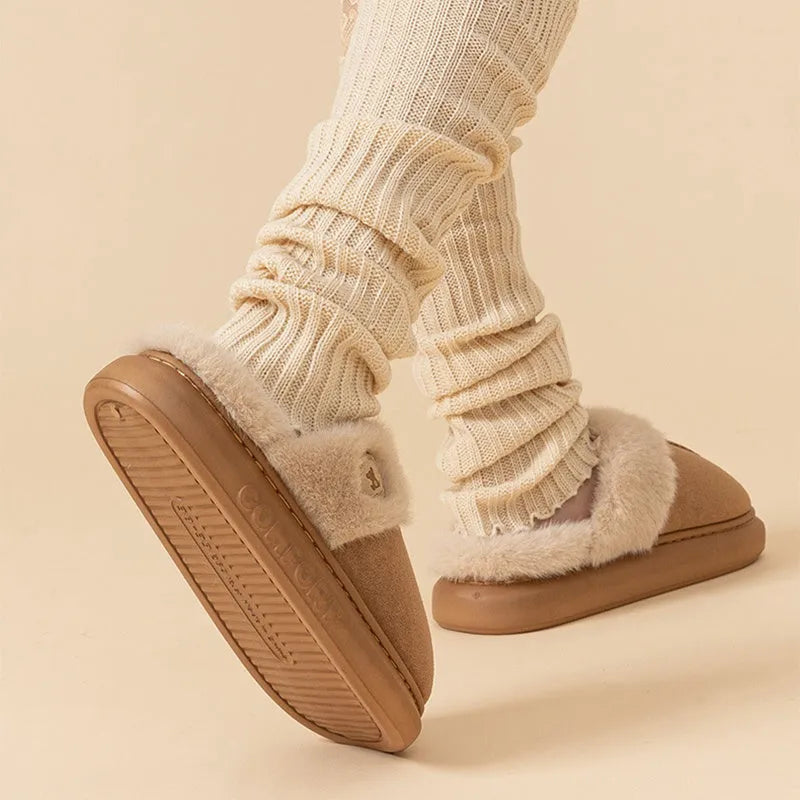 Plush fleece winter slipper with thick PVC sole, shown in khaki colour with car stitching detail.