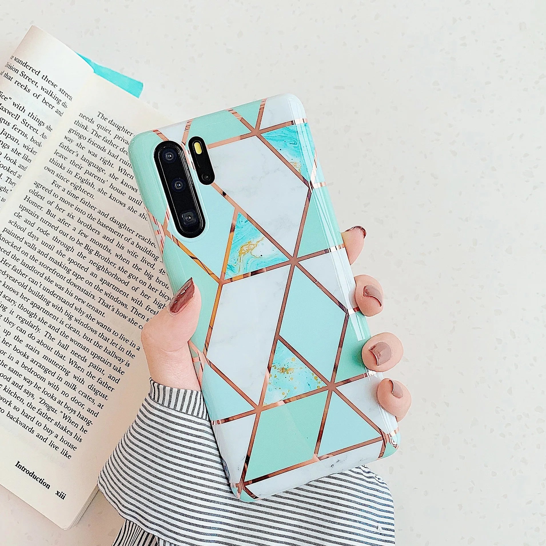 Electroplated marble pattern TPU back cover case for a Huawei or Samsung smartphone.
