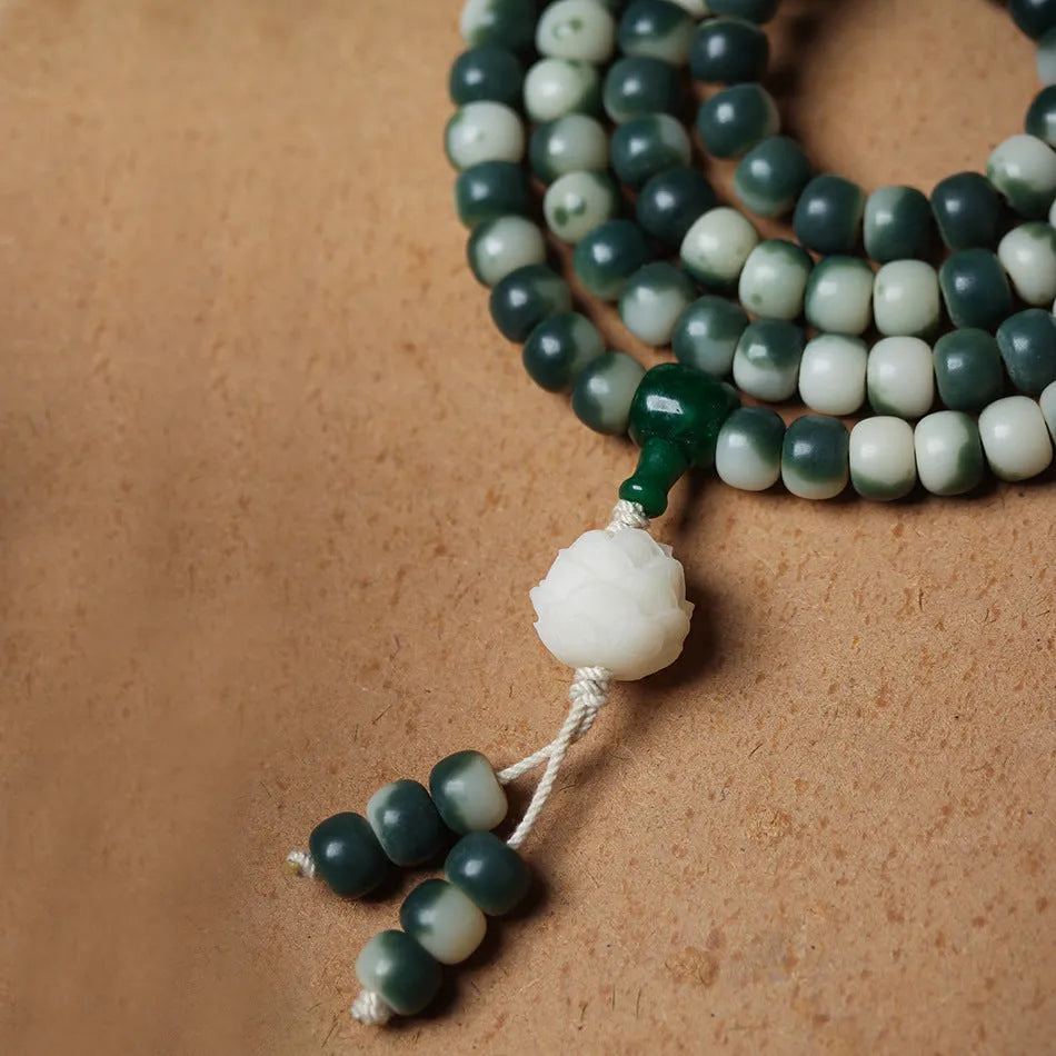 Lotus White Jade Bodhi Beads Bracelet showing floating flowers pattern on Bodhi root beads