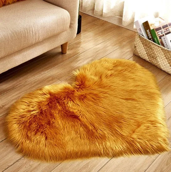 Heart-shaped plush carpet in multiple colours showing wool-like texture with 5-6 cm pile length