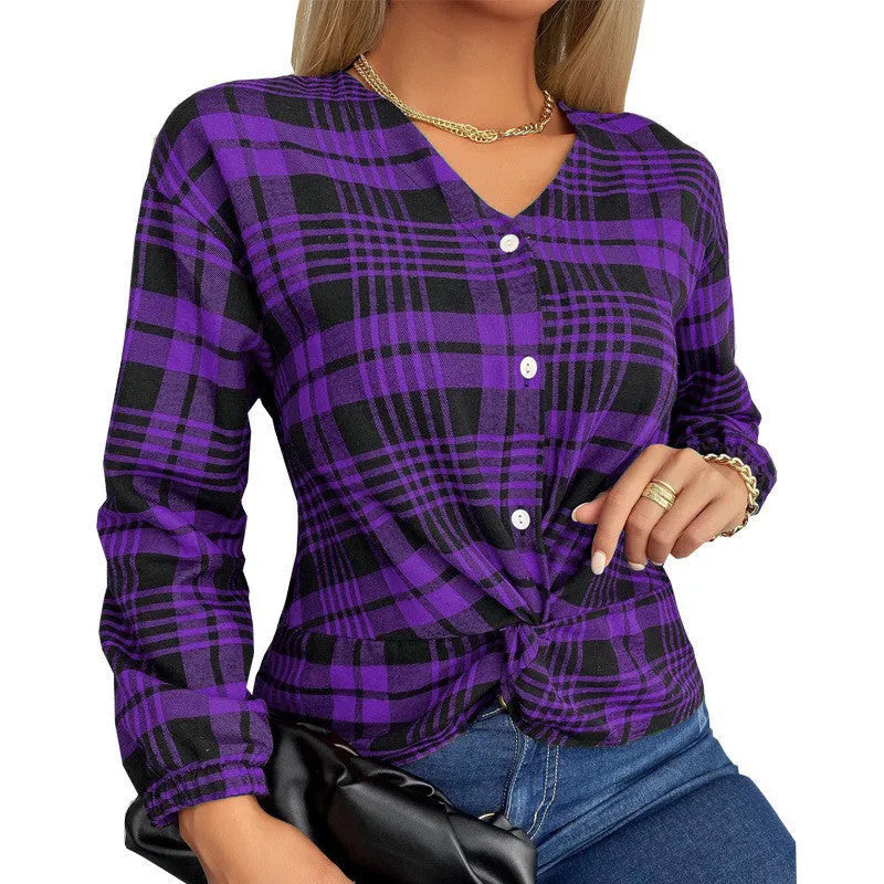 Women's loose fit purple plaid casual shirt with regular sleeves on a hanger.