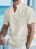 Men's apricot-coloured linen blend T-shirt with a stand collar and short sleeves on a hanger.