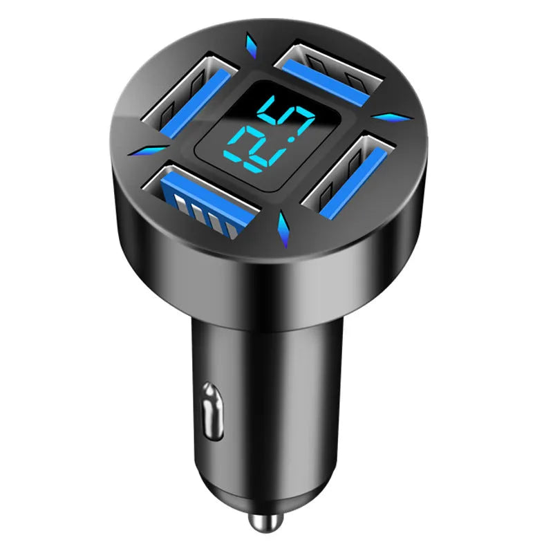 Black four-port USB car charger with LED voltage display plugged into a car socket.