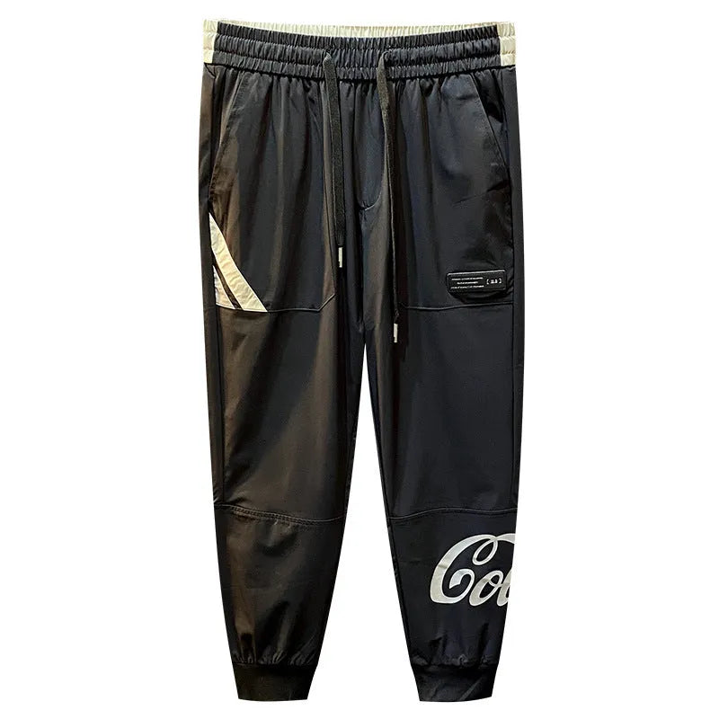 Men's black ankle band trousers with cropped casual fit in lightweight ice silk cotton fabric