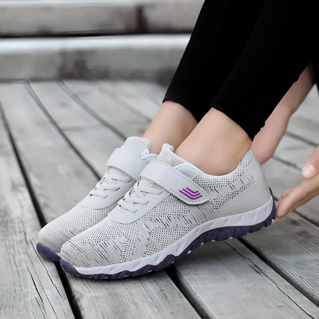 Women's low-top wedge heel shoes in grey purple with velcro strap and mesh upper.