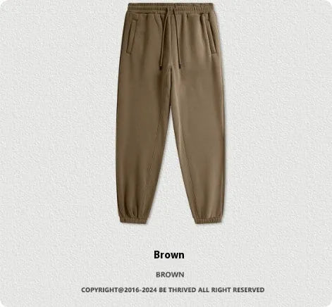 Men's solid colour cotton velvet sweatpants with elastic waist and ankle banding detail