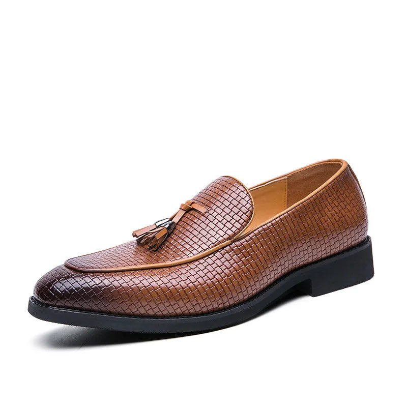 Men's black pointed toe slip-on shoe with a tassel on the low-top PU upper.