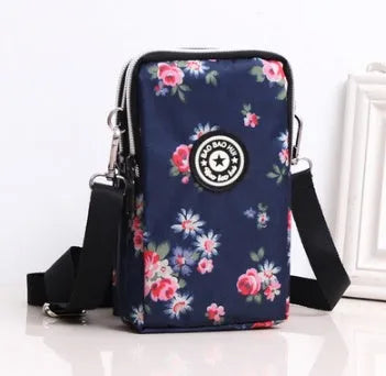 Vertical mobile phone bag in black with Oxford Spinning texture and zipper closure