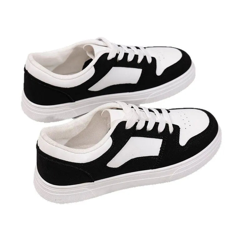 Black women's casual sports shoes with round toe, flat rubber sole, and lace-up front