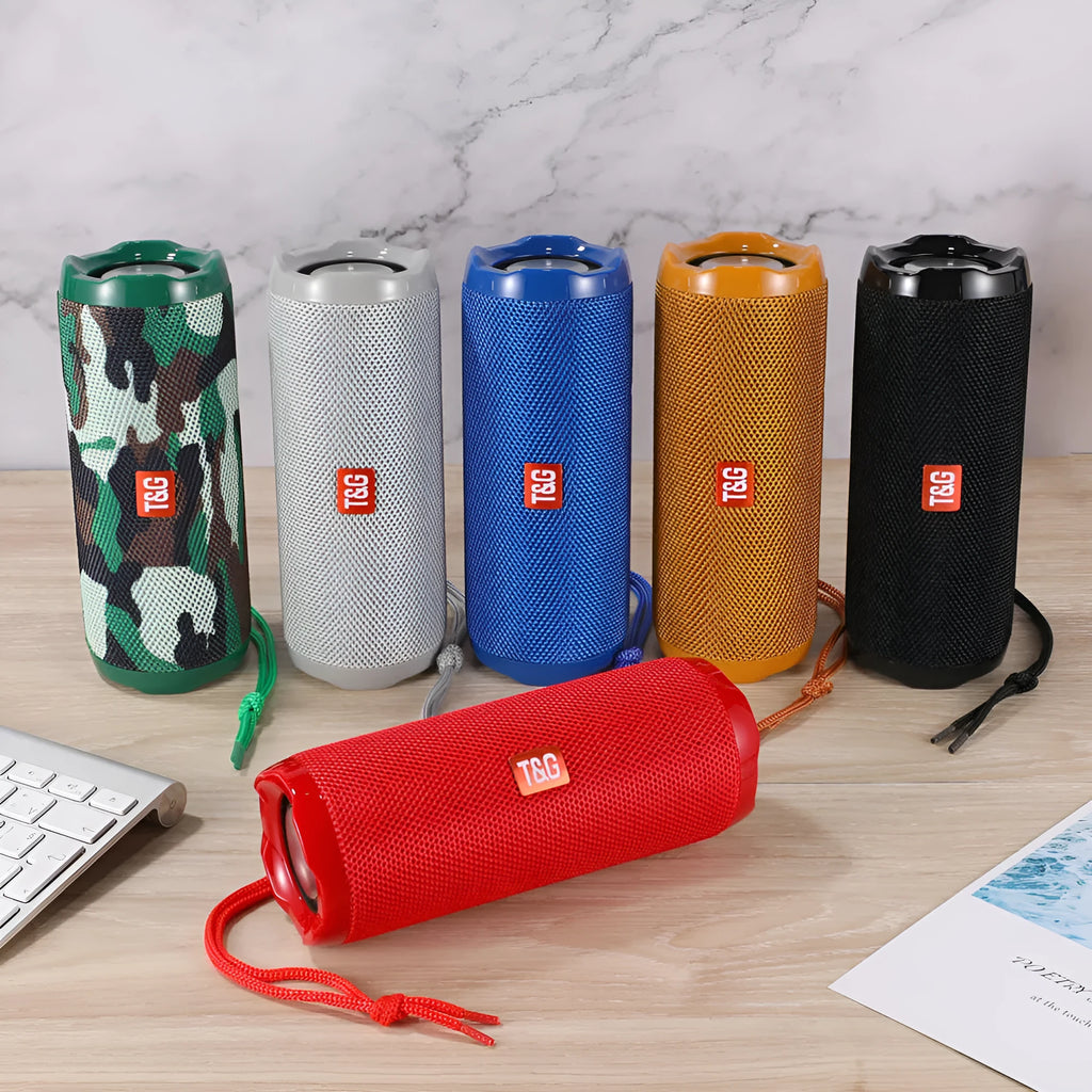 Fabric-covered portable Bluetooth speaker showing the integrated card holder slot, displayed in the camouflage colour variant.