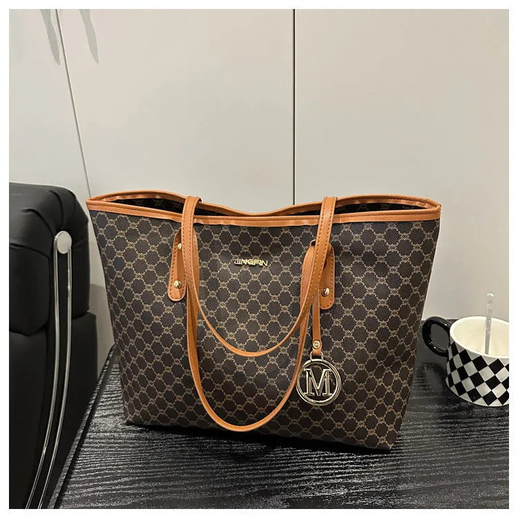 Black PU street-trend shoulder bag with sewing thread detail, shown with a 42cm wide top opening.