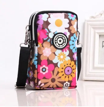 Vertical mobile phone bag in black with Oxford Spinning texture and zipper closure
