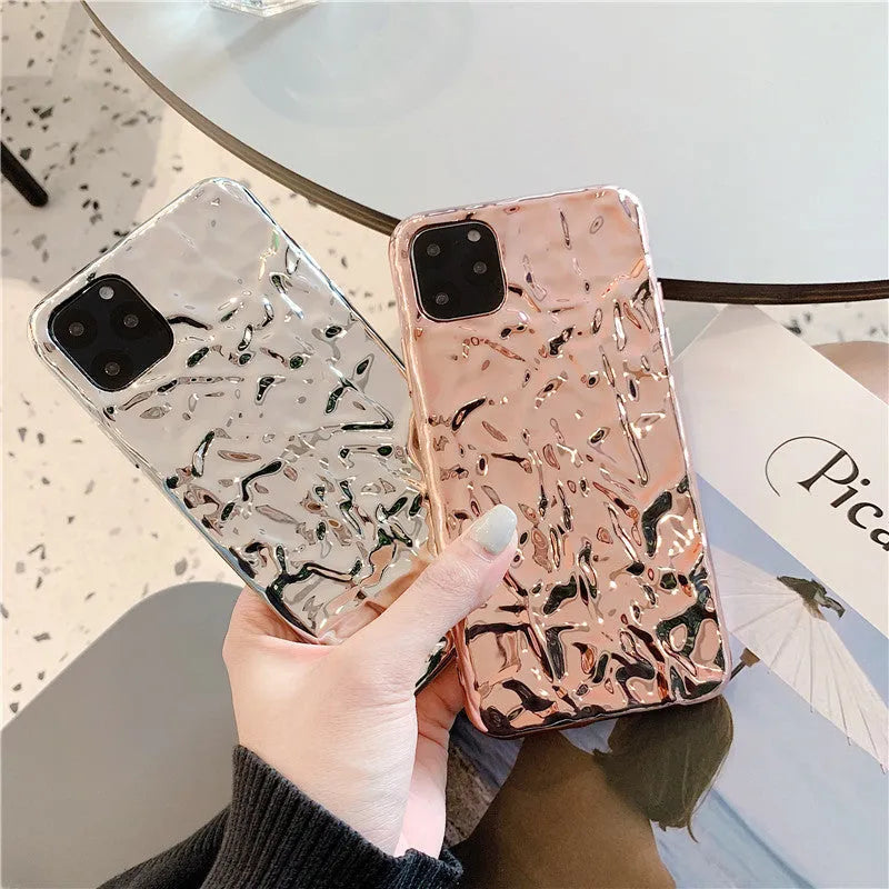 Rose Gold and Silver electroplated TPU folded back cover case for iPhone on a table