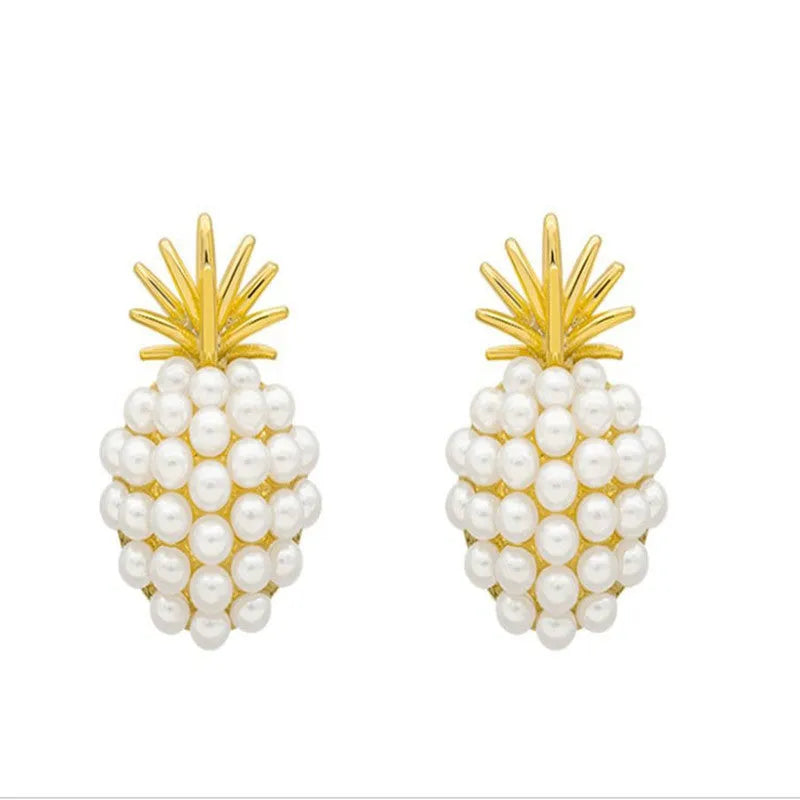 Gold pineapple and starfish pearl Korean style drop earrings with alloy electroplating and inlaid gems.