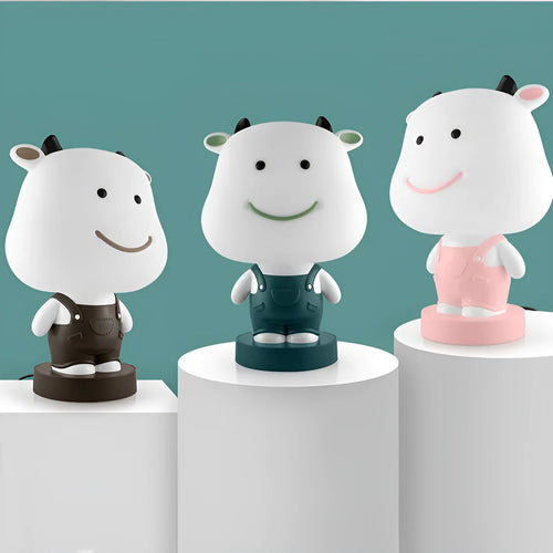 Cartoon style animal table lamp with plastic shade in random colour variation showing bear cattle rabbit or tiger design