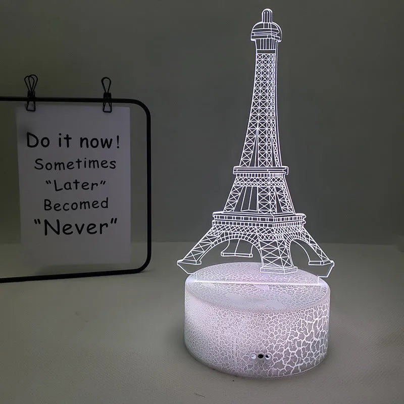 Eiffel Tower shaped table lamp with multi-colour 3D visual slide design and acrylic lampshade.