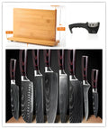 Eight different kitchen knives including chef's knife, bread knife, Japanese style knives, and fruit peel knife