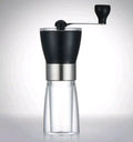 Hand coffee grinder 6cm by 17cm 310g black manual burr grinder on white background