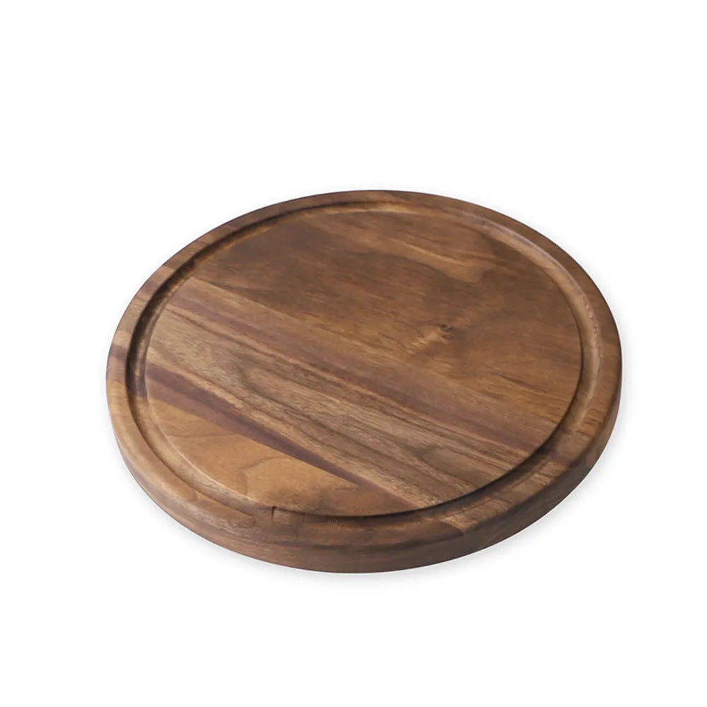 Black walnut wood cutting board set showing rectangular and round boards with juice grooves and side handles