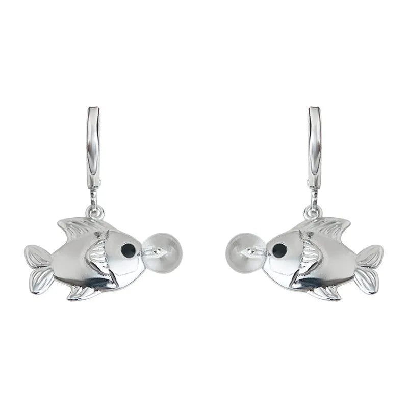 Copper electroplated bubble fish design earrings with goldfish animal modelling on a white background.