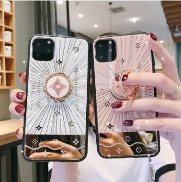 Gold-plated diamond ring adhesive phone stand grip mounted on iPhone