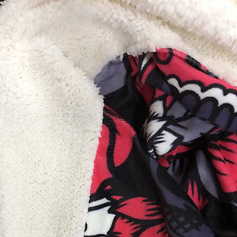 Round coral coloured flannel burrito blanket with a delicious print, shown folded.