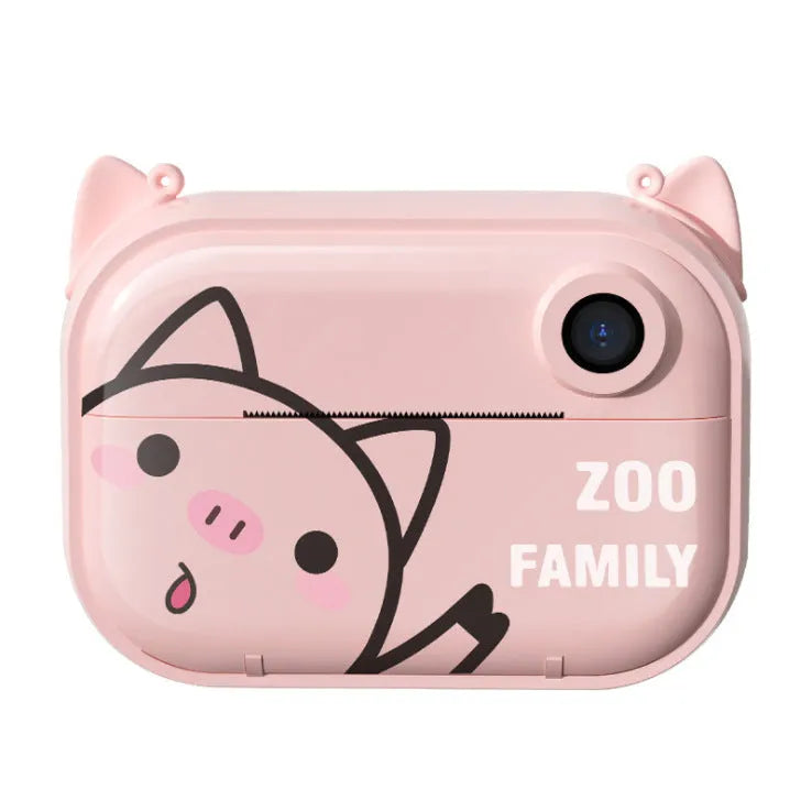 Pink C3 instant print digital camera with 2.4-inch screen, placed alongside included printing paper, stickers, and accessory pack