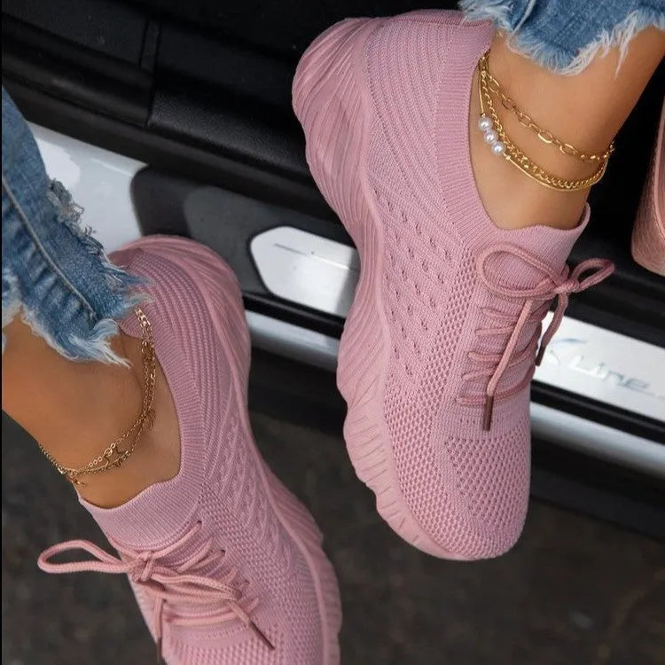 Women's chunky platform sneaker in a solid colour with a thick sole, shown from the side.
