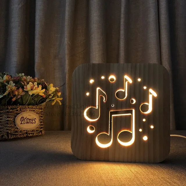 Square 3D wooden lattice USB lamp emitting warm white light on a desk, showing pine grain and USB cable.