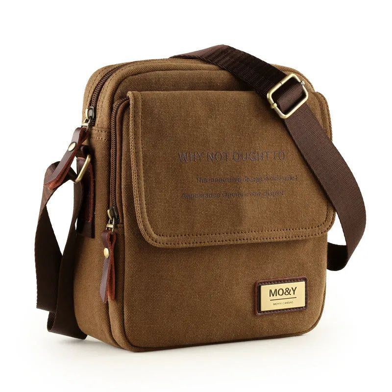 Canvas shoulder bag in khaki with polyester lining, small size 20x7x23cm, shown as a structured day bag
