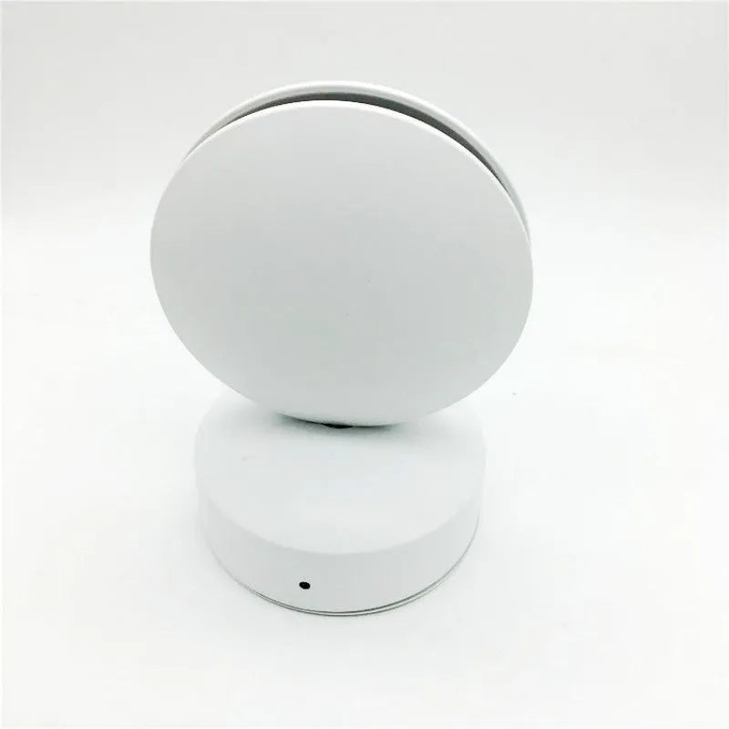 Modern aluminium spotlight bar wall lamp with glass lens, mounted on a wall.